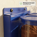 Close-up van het gecoate metalen frame waarmee de Duo Dispenser aan de wand is bevestigd.